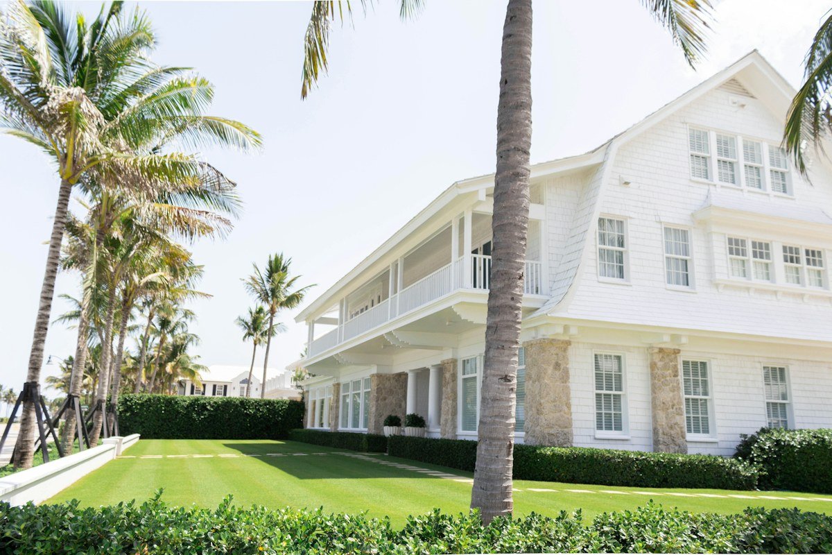 Florida real estate home with palm trees - market report
